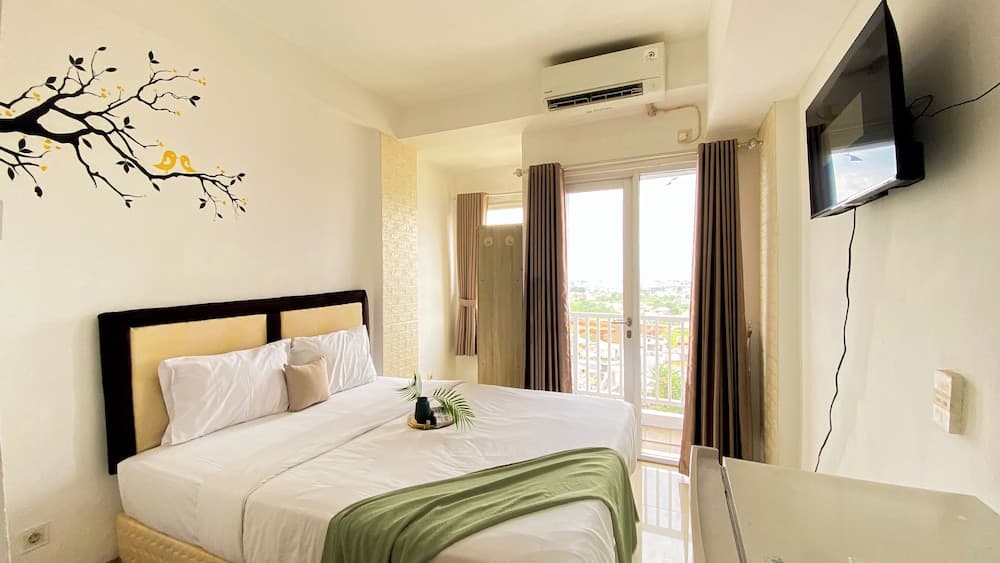 Homey And Cozy Living Studio At Poris 88 Apartment