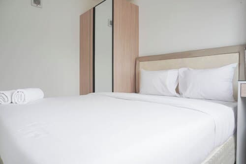 Homey and Minimalist 2BR at Podomoro Golf View Apartment