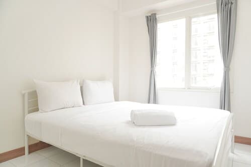 Minimalist and Restful 2BR at Podomoro Golf View Apartment