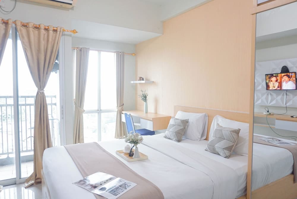 Cozy Stay and Strategic Studio Apartment at Grand Dhika City