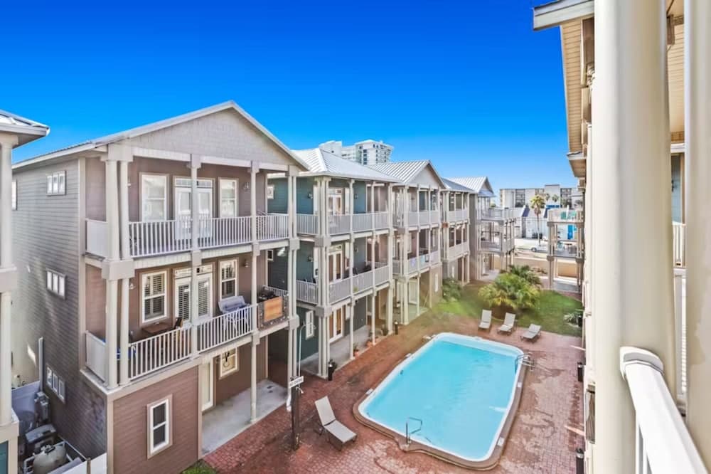 Serenity by the Sea! 4BR Retreat, Sleeps 12, Walk to Beach & Community Pool