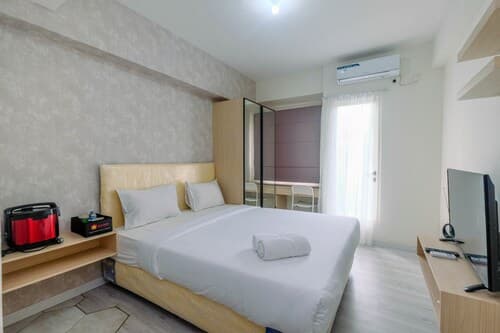 Sophisticated Studio Room At Podomoro Golf View Apartment By Travelio