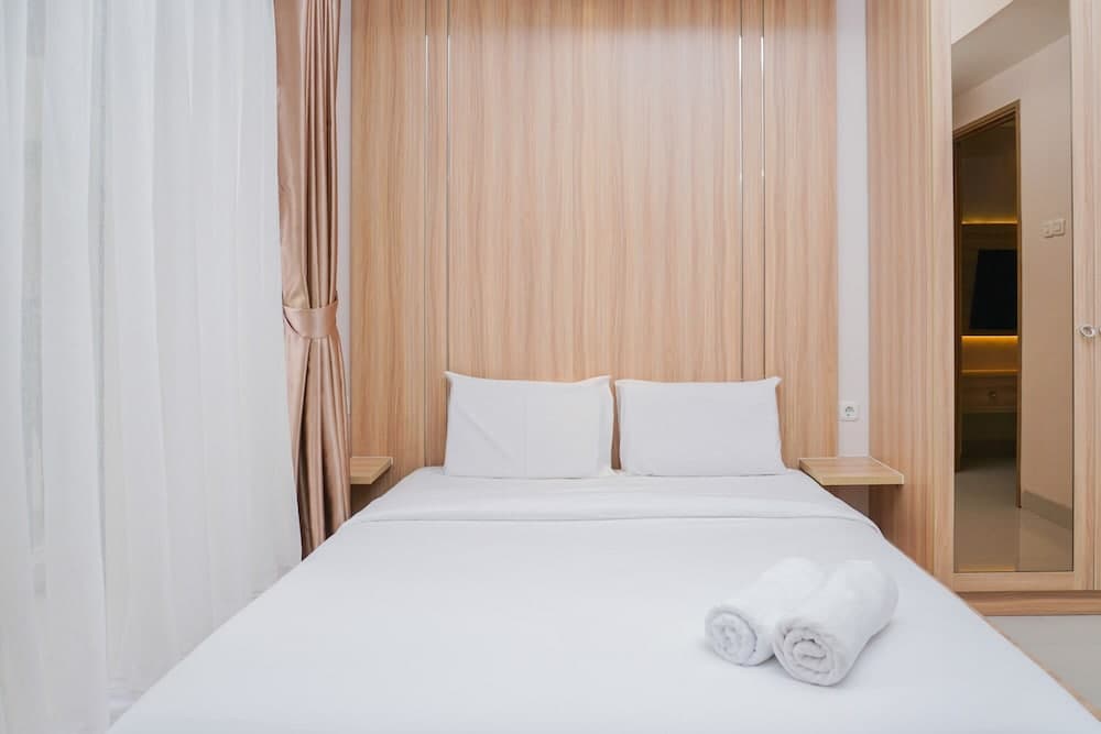 Clean and Elegant 1BR at The Oasis Apartment