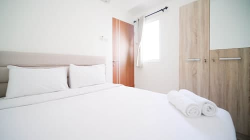 Cozy Living And Tidy 2Br At Puncak Dharmahusada Apartment