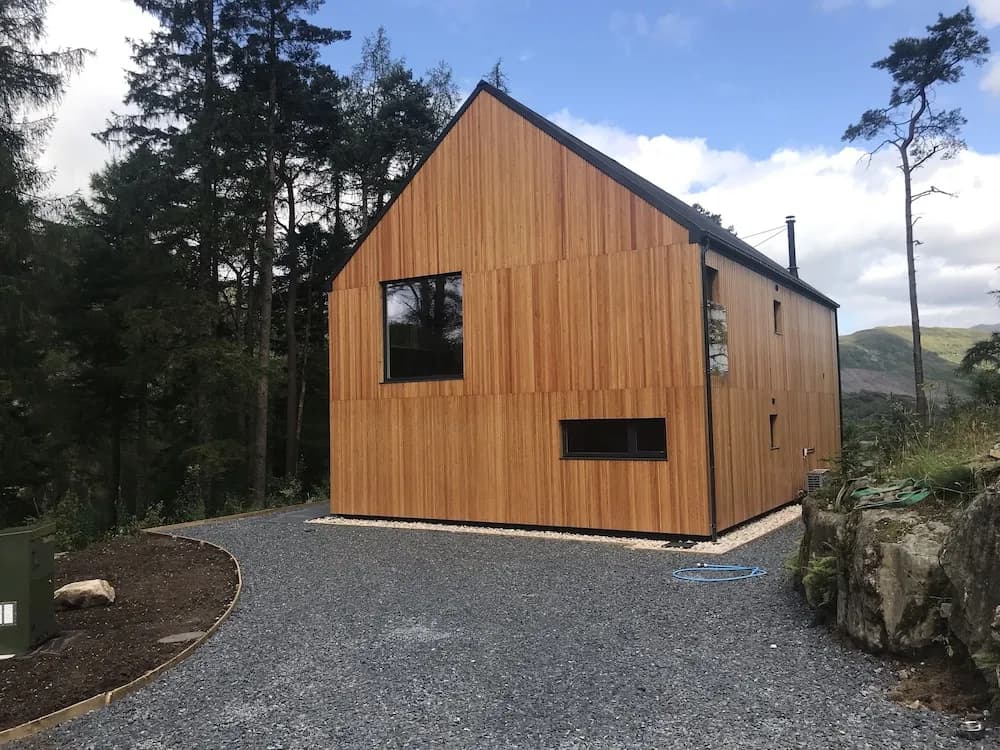Red Stag With Stunning Loch and Waterfall View