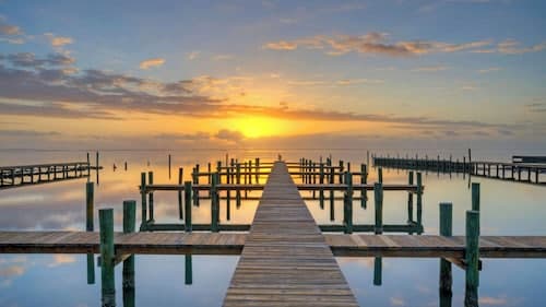 Balcony w/ Bay View Shared Pool + Boat Dock Fat Flounder by Avantstay