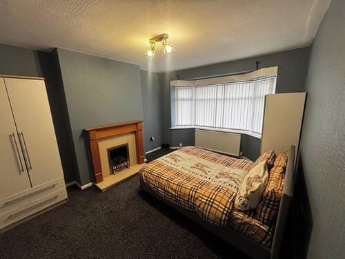 Housesleeps9-fireplace-garden-bbq-tv